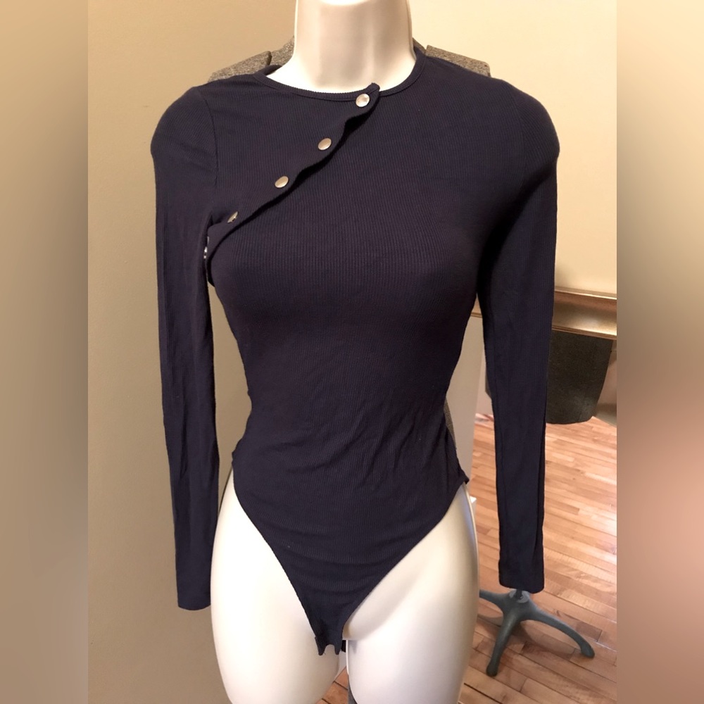 NWOT by the way from Revolve. Ribbed Navy blue front snap body suit. Size xxs